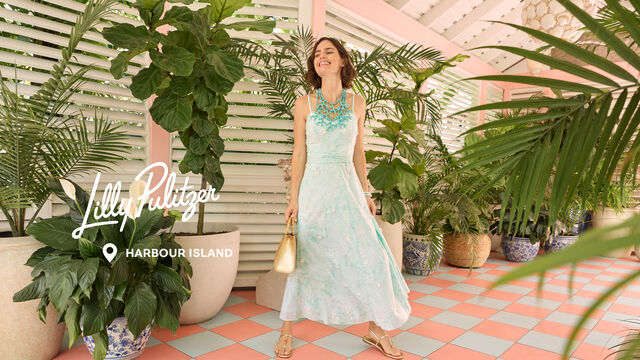 Model in long blue occasion dress
